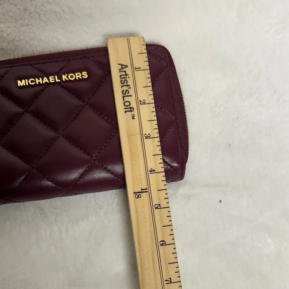 Michael Kors Plum Quilted Wristlet/ wallet